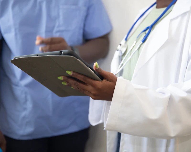 Doctor reviewing information on a tablet